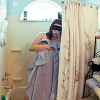 Woman stepping out of a shower